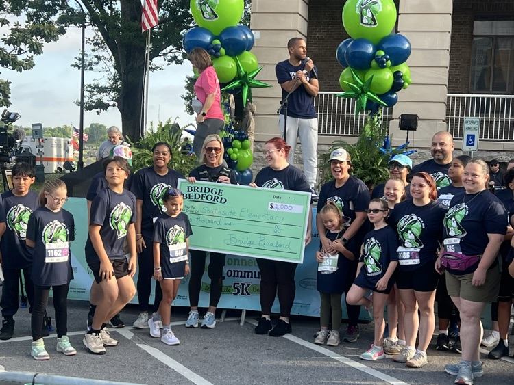 people holding a check