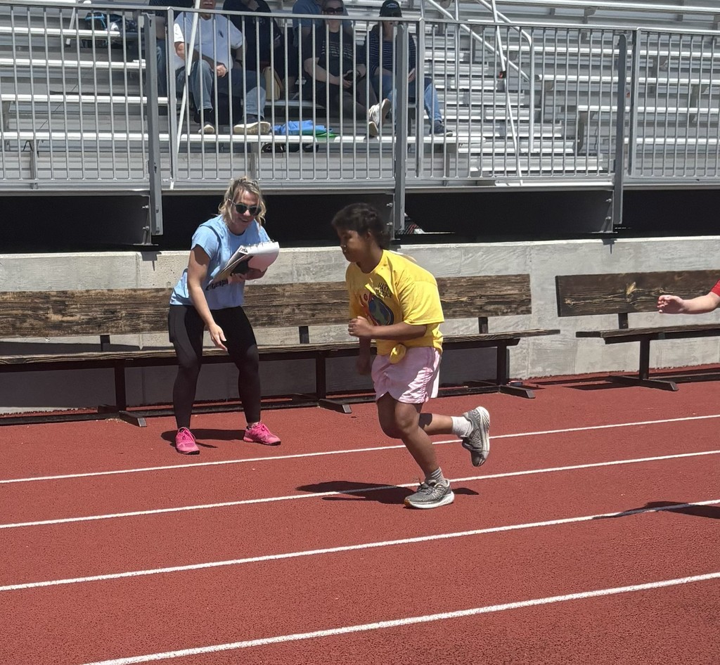 A student is participating in a race on the track. 