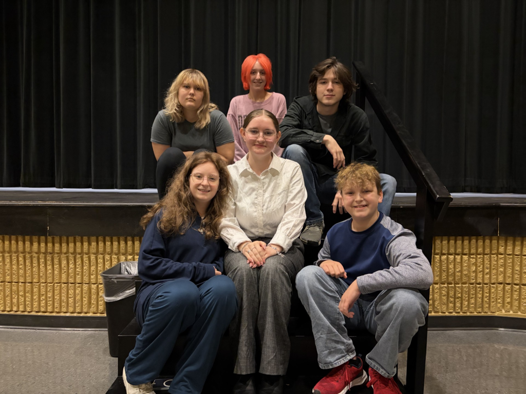 Community High School Smokestack Theatre Group Posed for a Picture in the Theater.