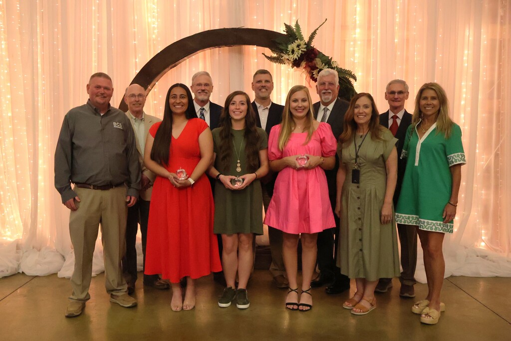 A group photo of those who received award along with the school board members, superintendent and assistant superintendent. 
