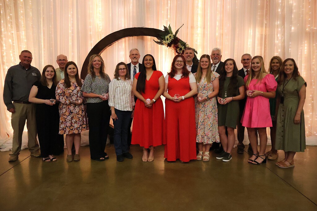 A group photo of those who received award along with the school board members, superintendent and assistant superintendent. 