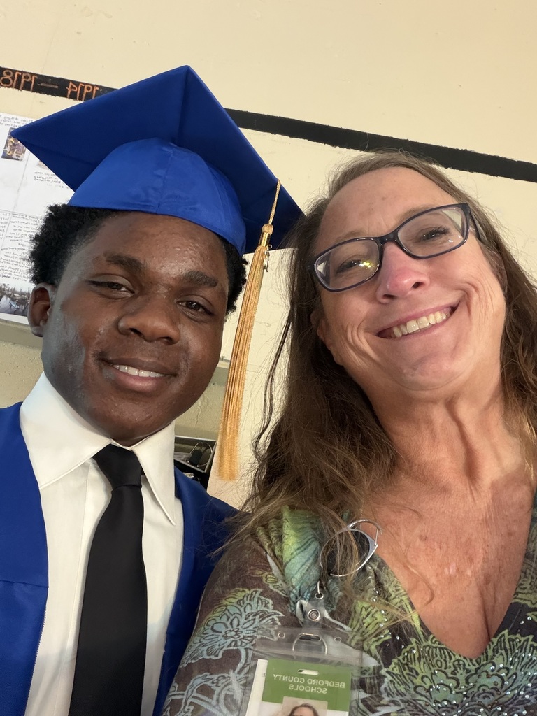graduating student and teacher