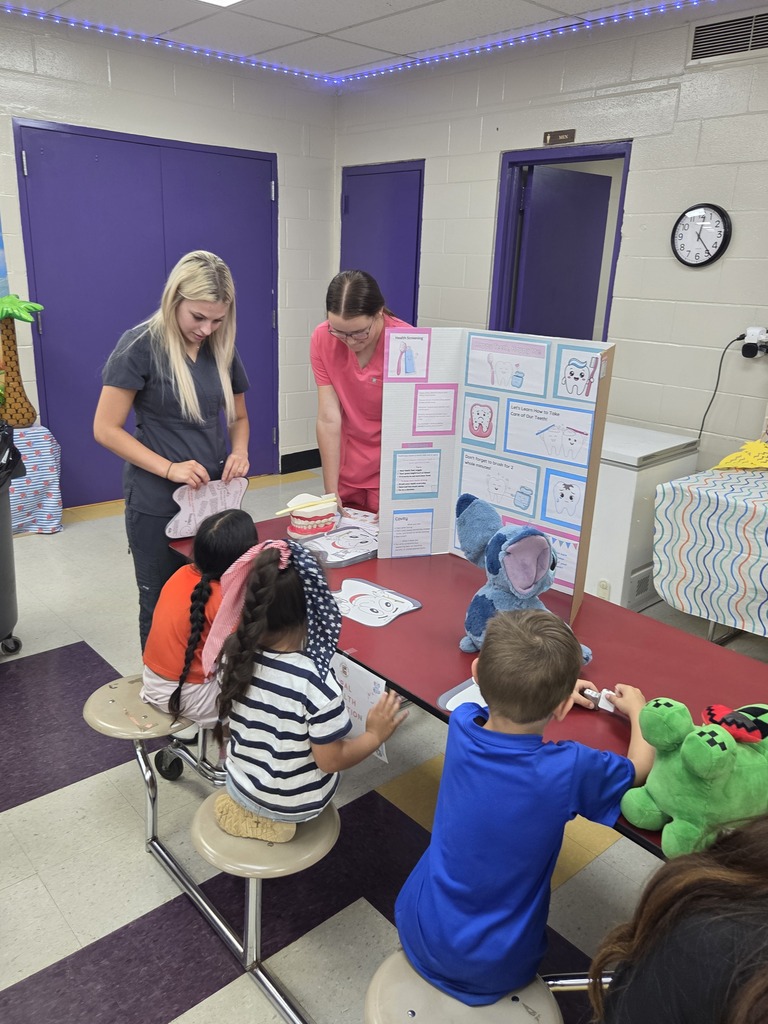 Medical Therapeutic students participate in the stuffie clinic with three students and their stuffed animals. 