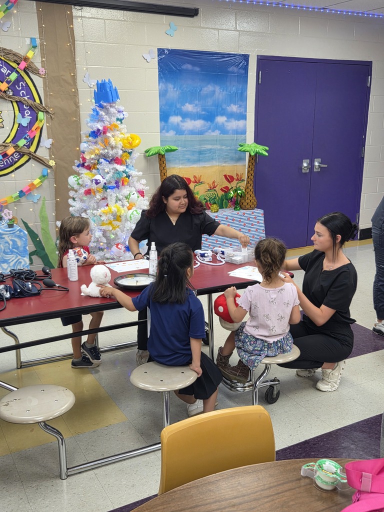 Medical Therapeutic students participate in the stuffie clinic with three students and their stuffed animals. 