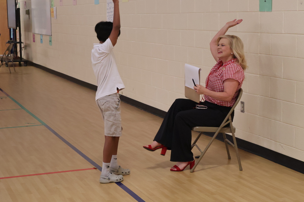 A student is participating in a role in the Amazing Shake competition. 