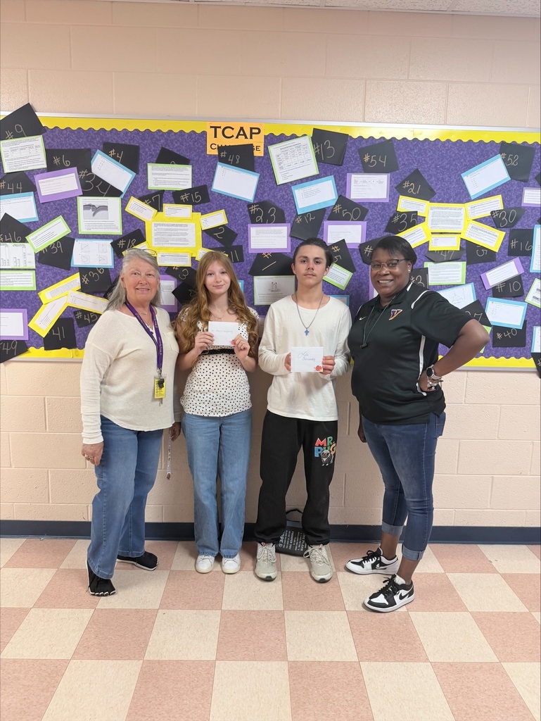 students and adults standing for a picture