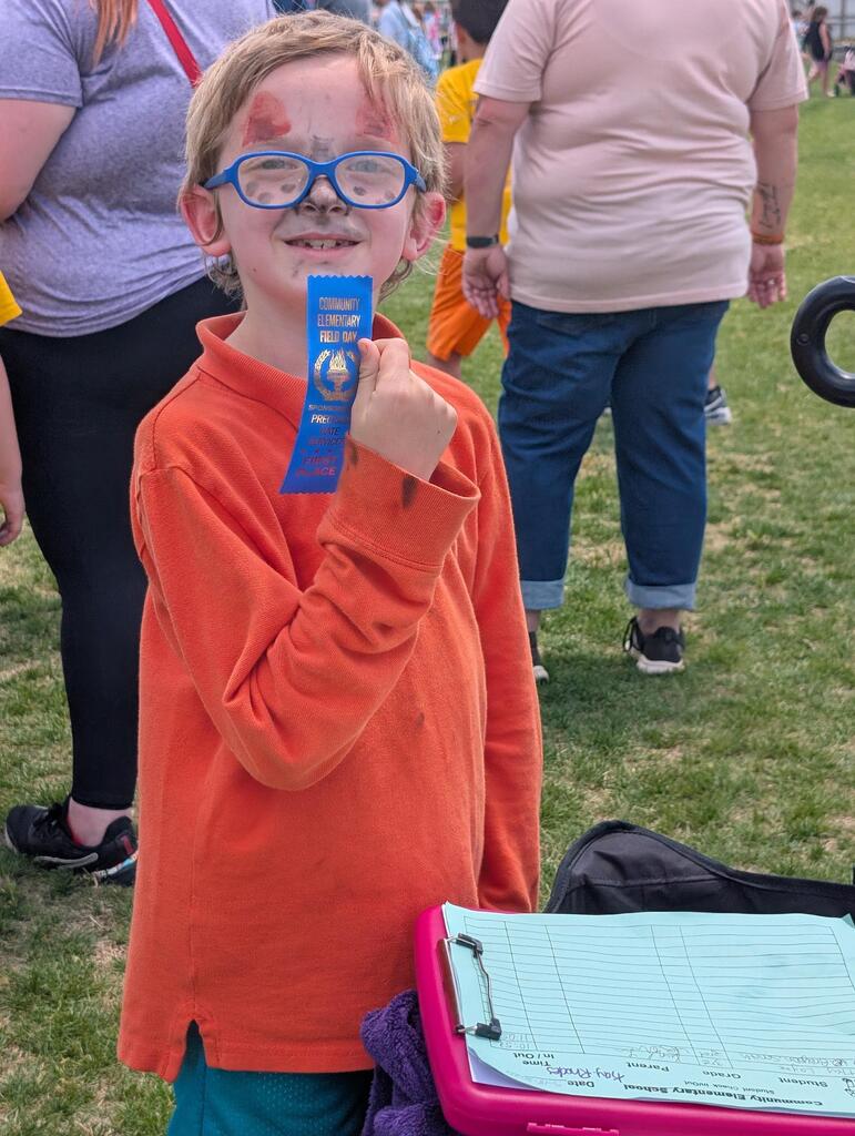 Field Day pictures of students playing and enjoying the beautiful day