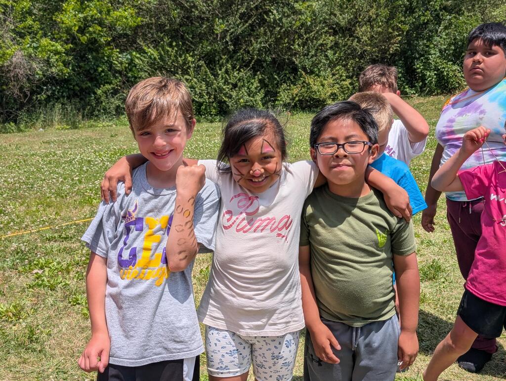 Field Day pictures of students playing and enjoying the beautiful day