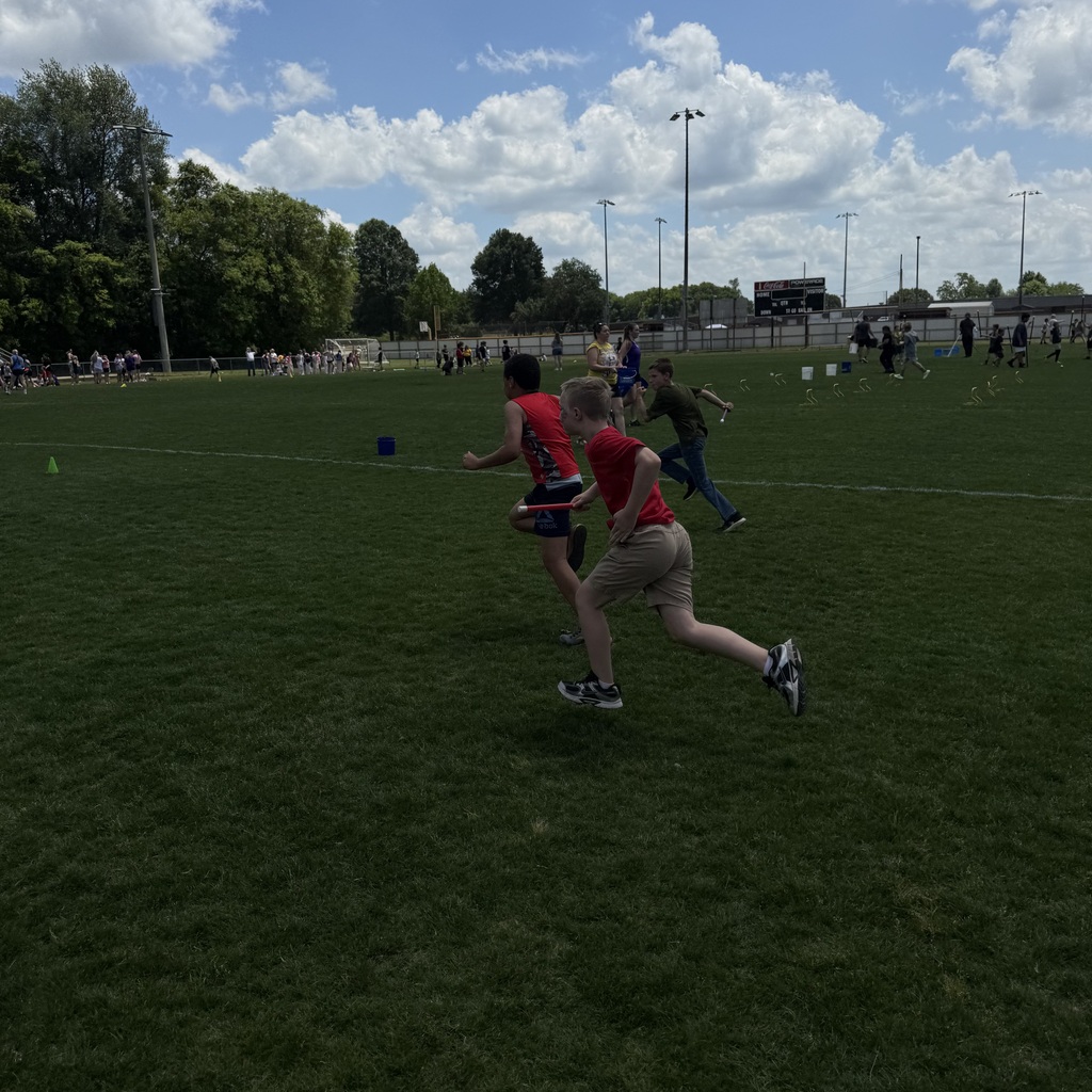 Field Day pictures of students playing and enjoying the beautiful day