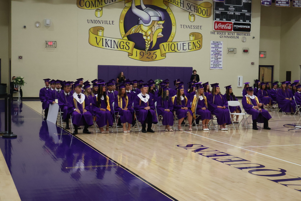 A group shot of students in their caps and gowns on honors day.