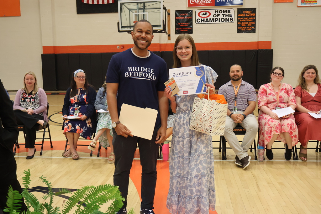 The HERO award recipient from Cascade Middle School poses for a picture with one person. 