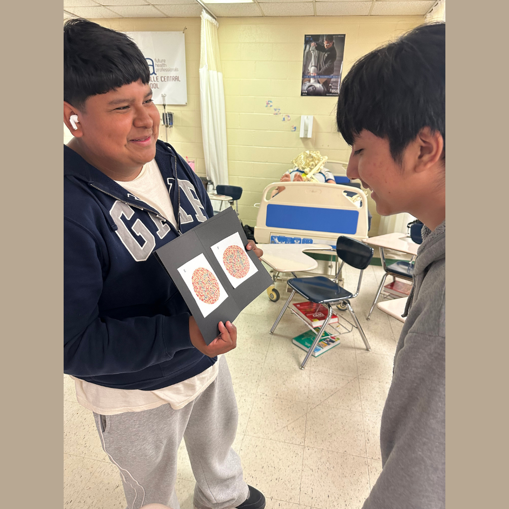 Students are participating in a 5 station vision lab. 