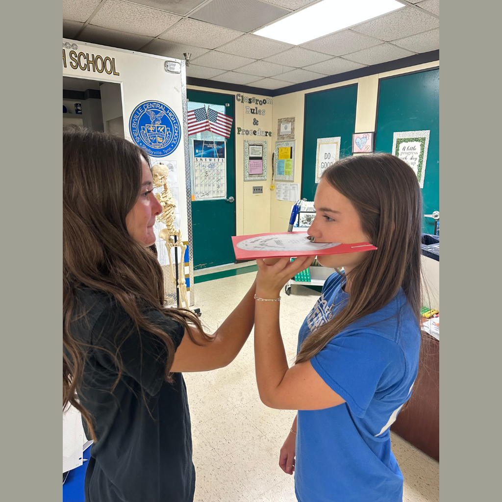 Students are participating in a 5 station vision lab. 