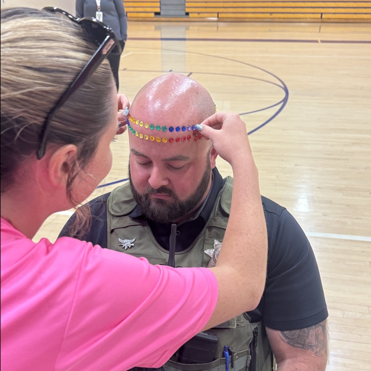 adult getting gems on his head