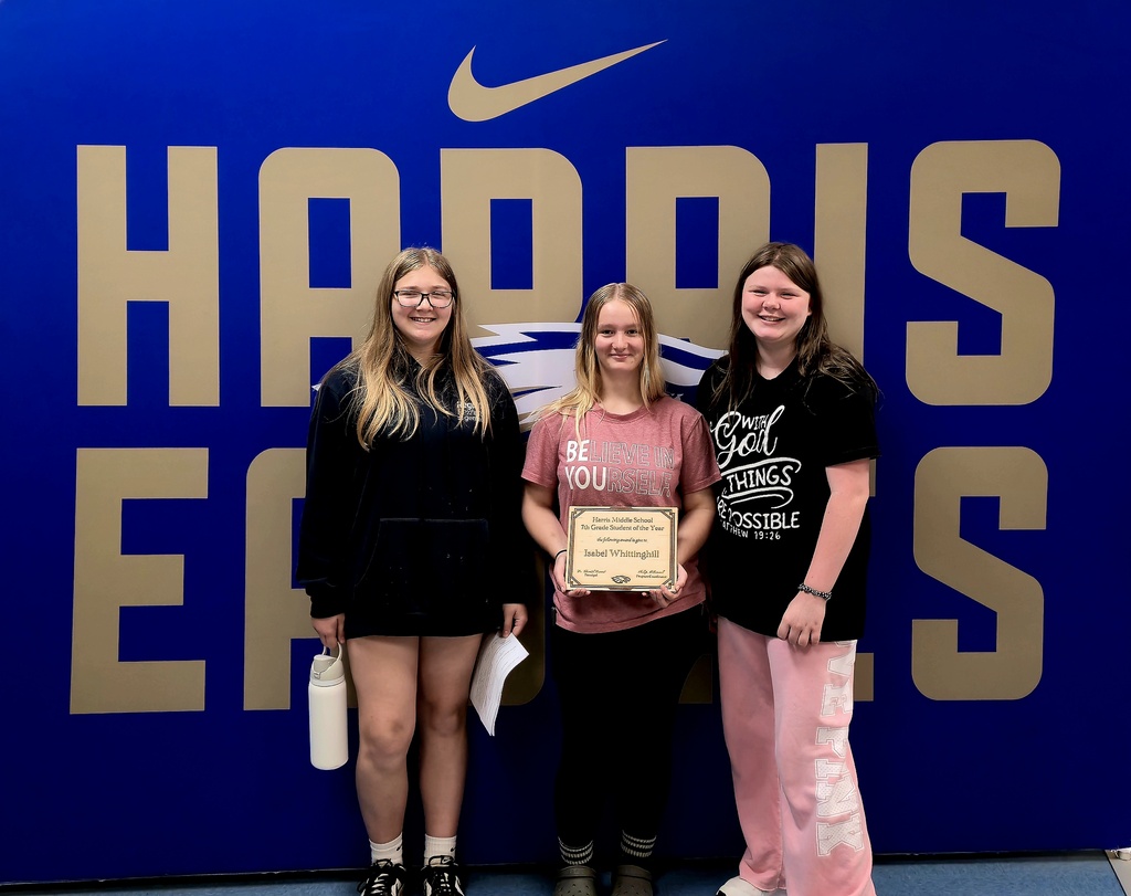 Isabel poses with friends after winning the award