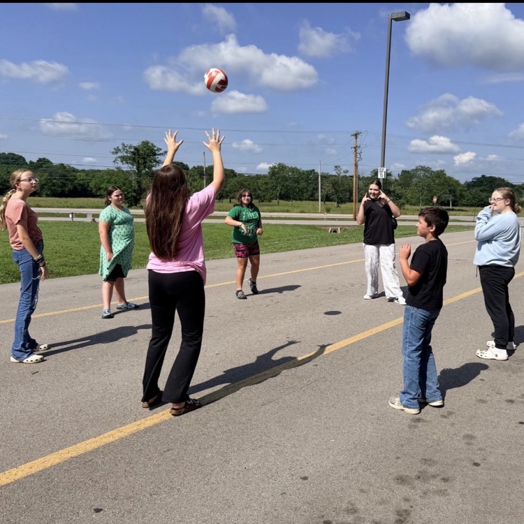 students playing volleyball