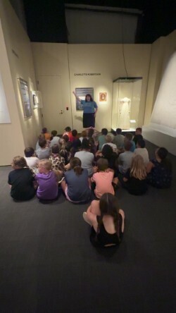 Students are sitting inside of a room learning more about Tennessee's history.