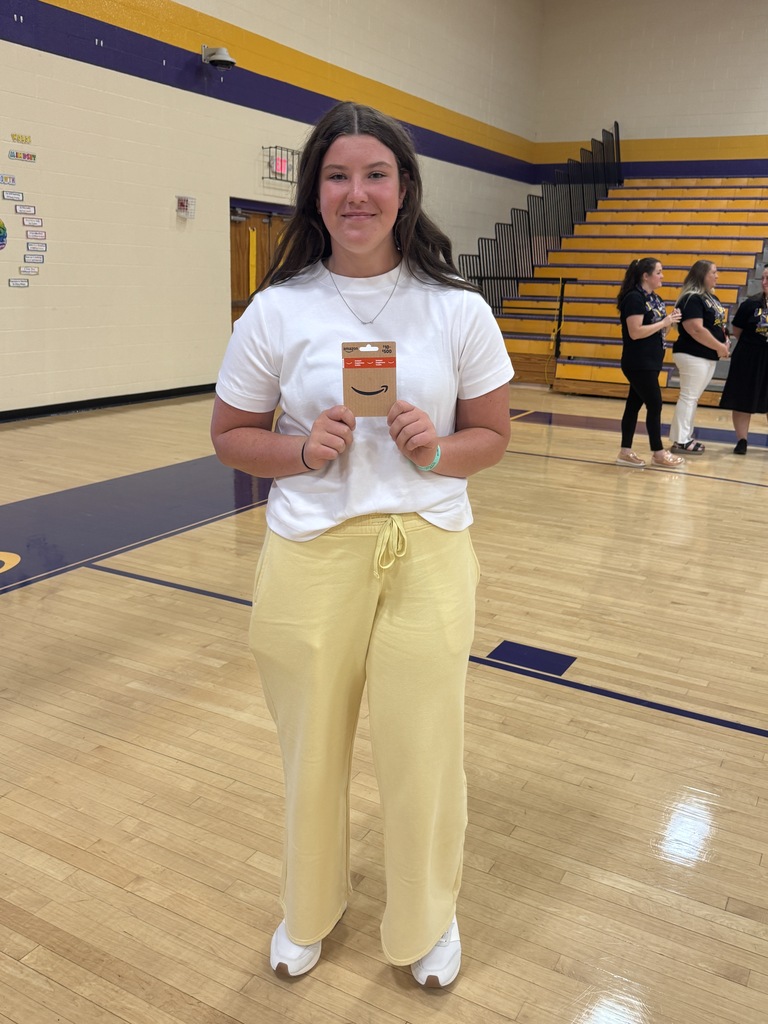 girl smiling with a gift card