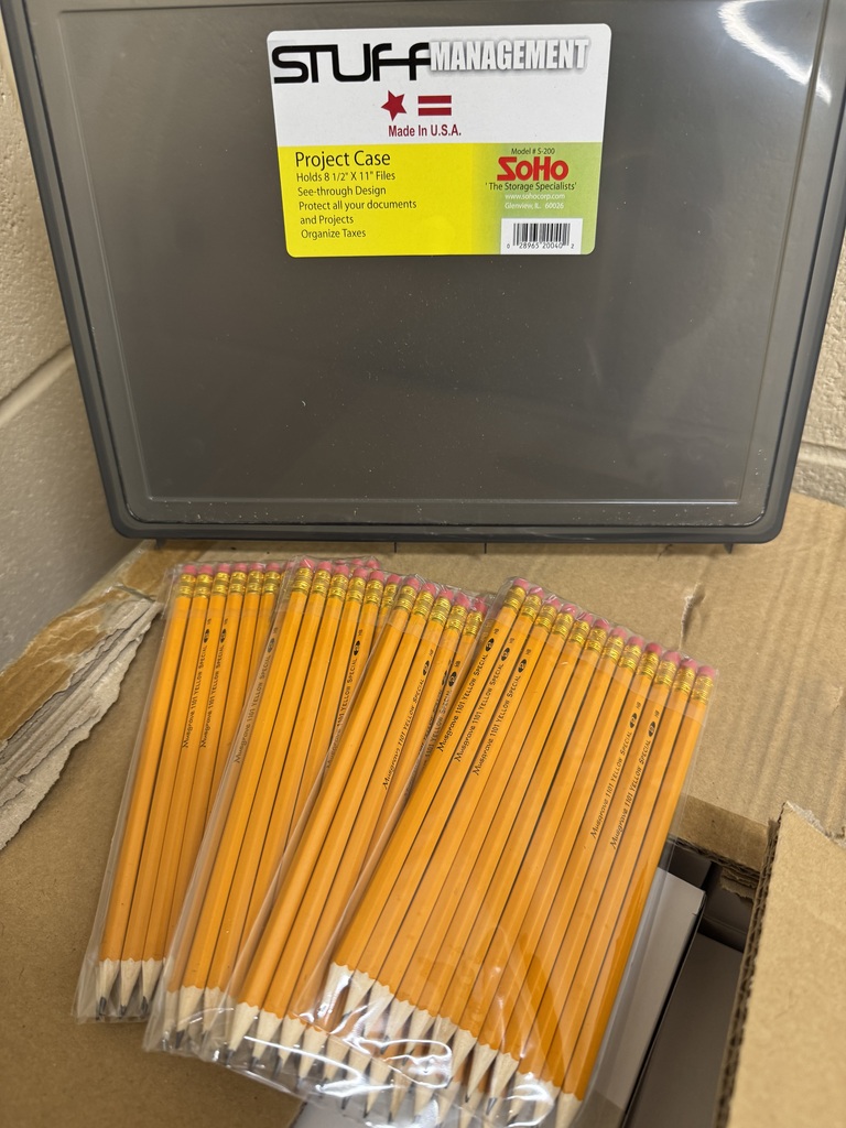 Gray storage case filled with yellow #2 pencils donated by Musgrave Pencil Company to Cascade High School.