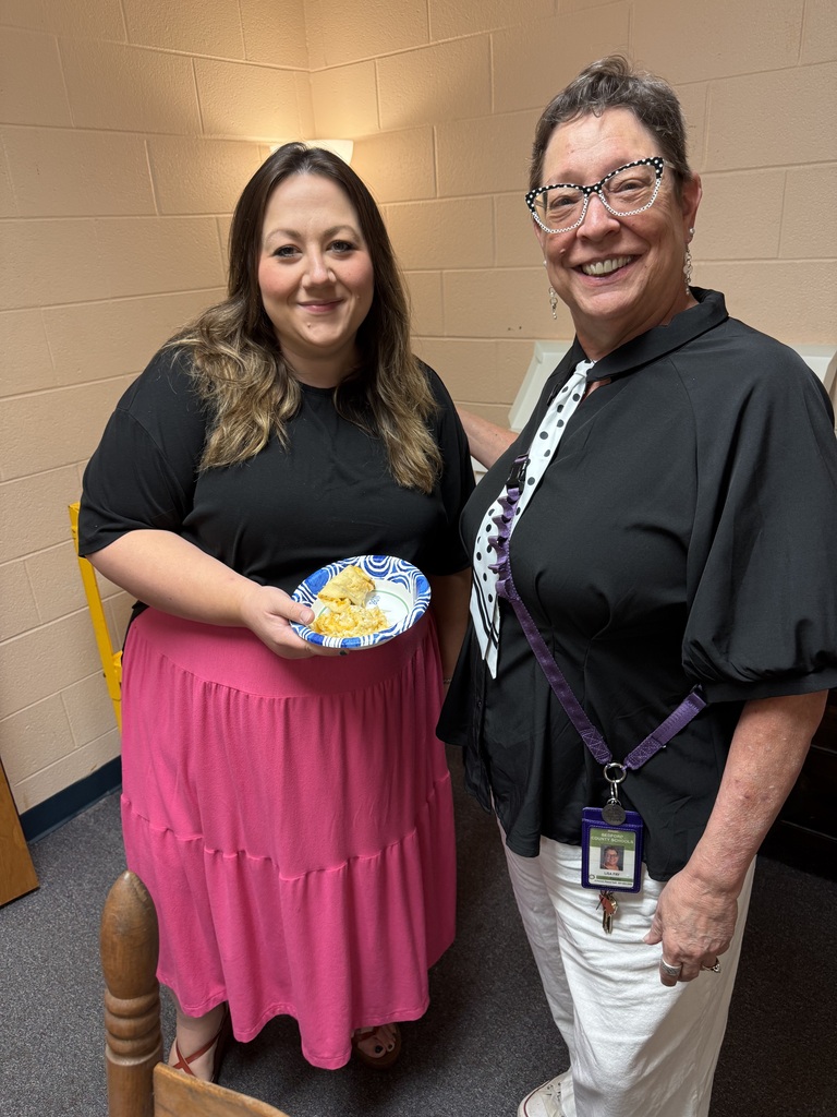 women smiling holding food