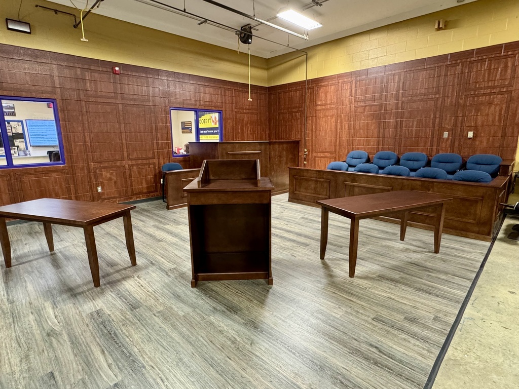 This is a more broad view of the mock courtroom where you can see the jury seats, tables and the area where the judge would be sitting.