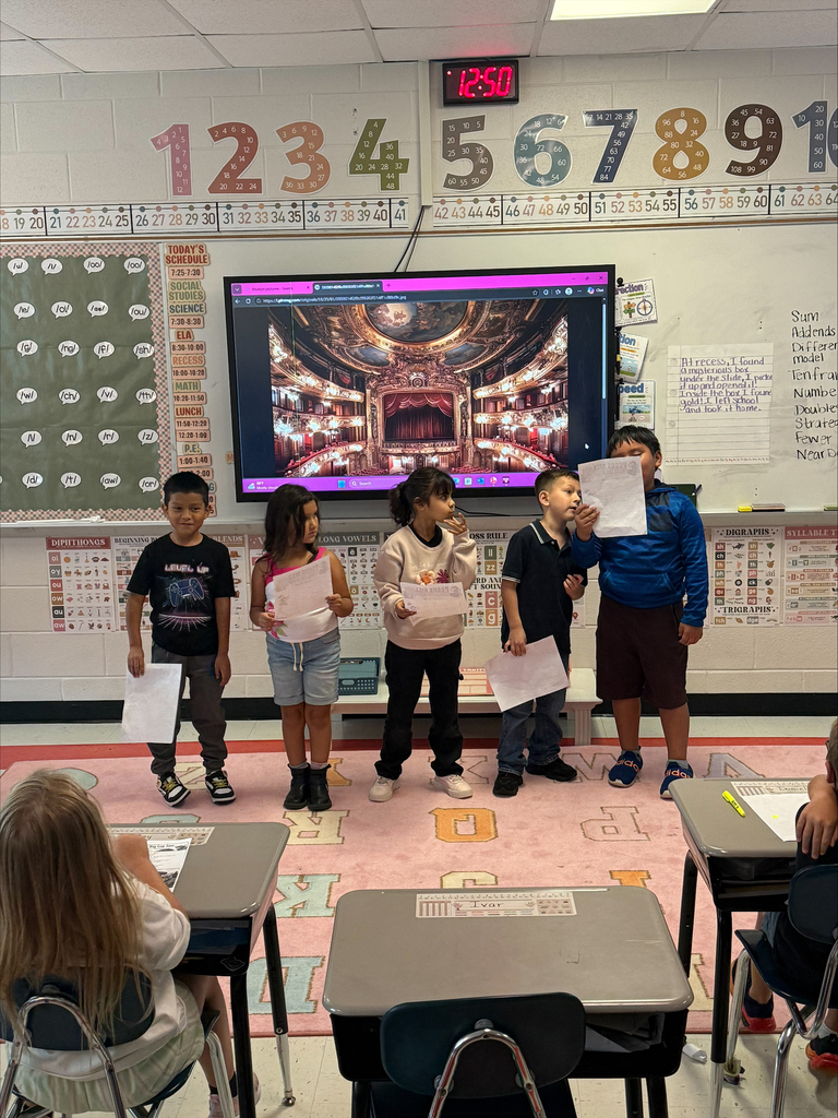 5 students presenting in front of the class