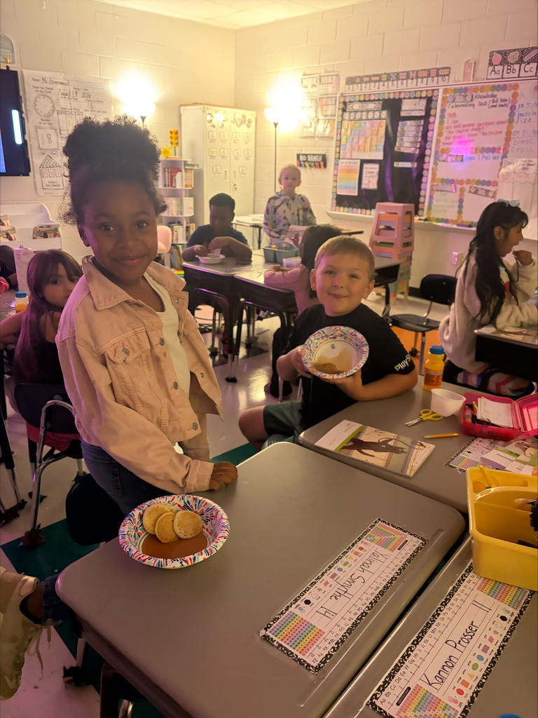 1 boy and 1 girls showing their pancakes