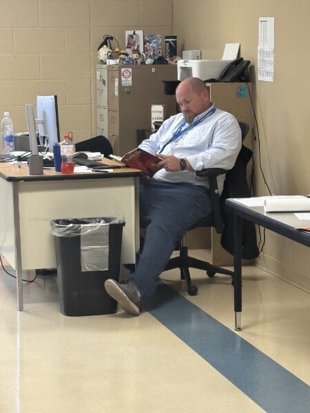 Dr. Bowling taking a moment to read