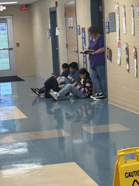 A few students and Mrs. Roe drop everything and read