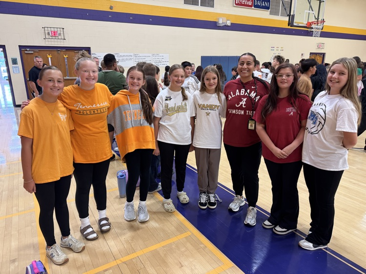 students and adult smiling