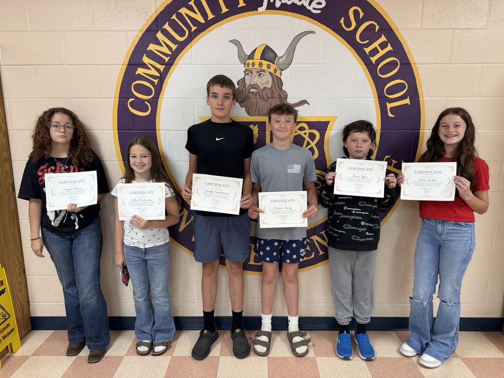students holding certificates