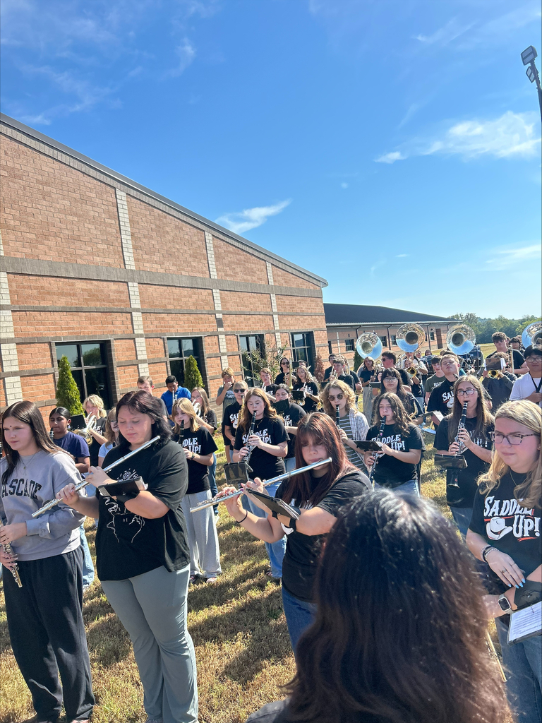 Cascade High School marching band performing outdoors during 9/11 flag raising ceremony