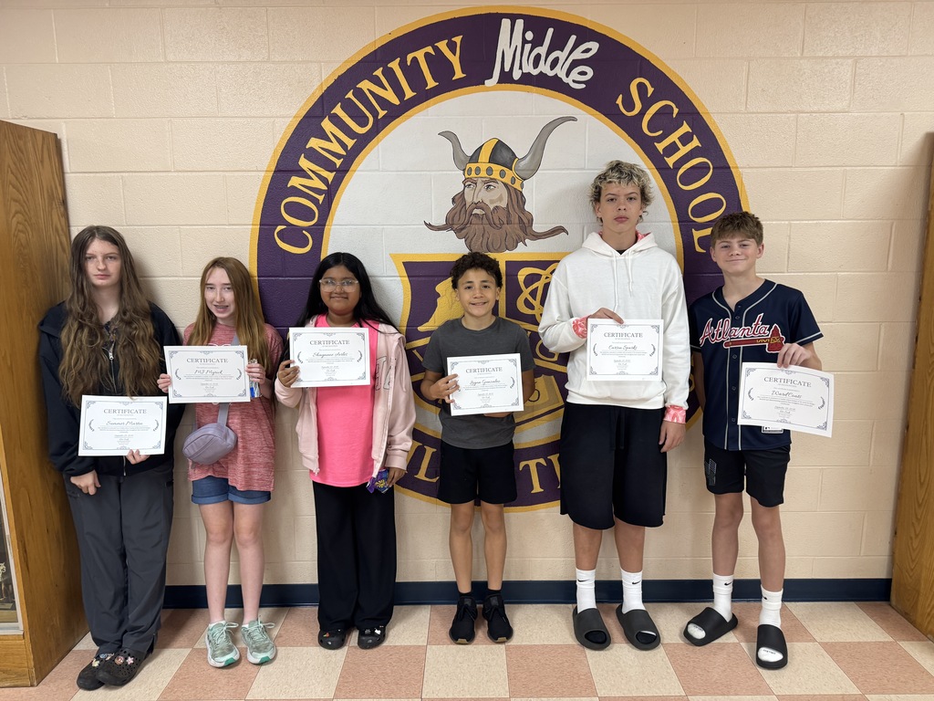 students smiling with certificates