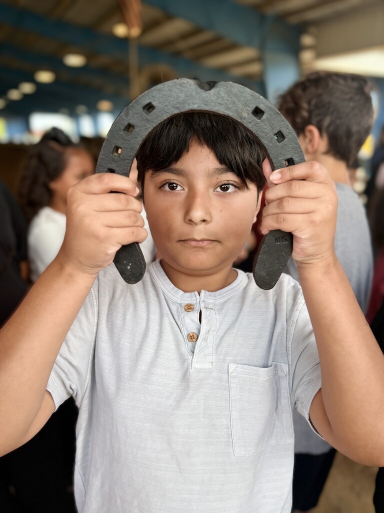 1 student with a horse shoe