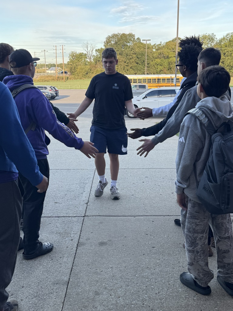 boys giving high fives