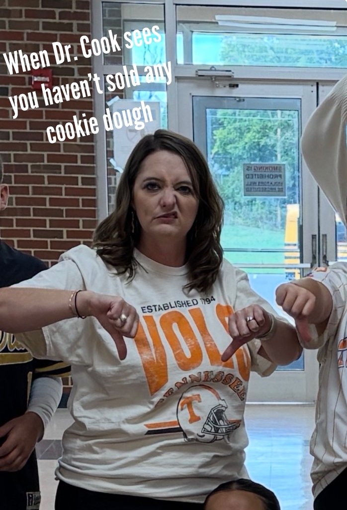 person making a bad face with thumbs down