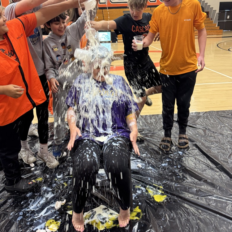 person getting milk dumped on them