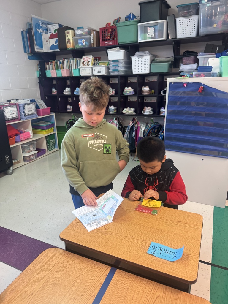 1 student reading to another