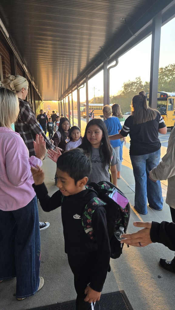 teachers high-fiving students