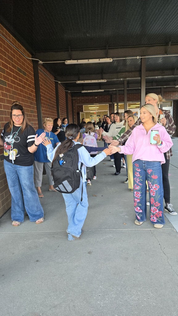 teachers high-fiving students