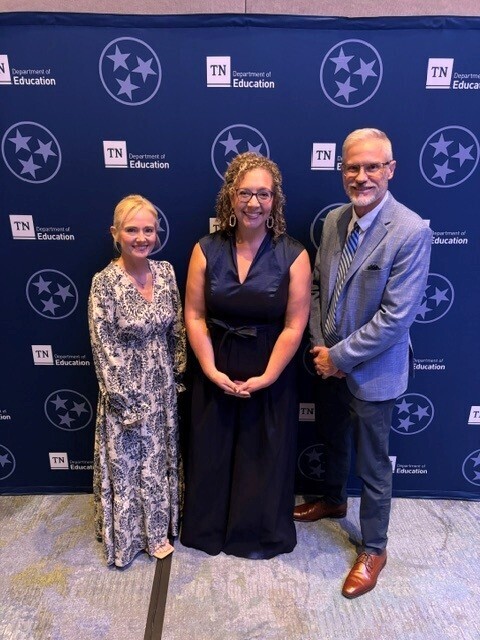 Principal Meredith Gilliland is standing beside Assistant Principal Angela Tyre and Superintendent Tim Harwell for a group picture.