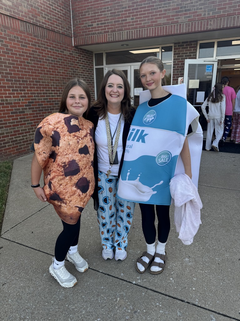 woman with two girls dressed as milk and cookie