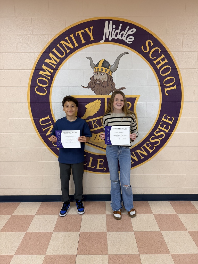 two students with certificates