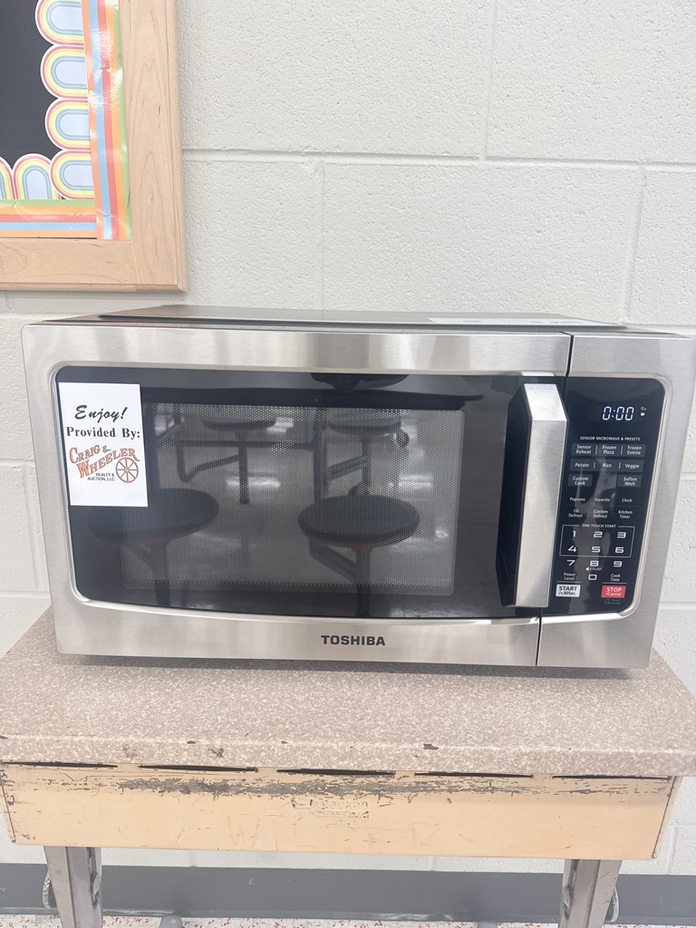 New Cascade cafeteria microwave provided by Craig & Wheeler Auction and Realty