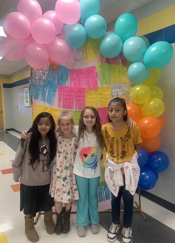 students with a colorful backdrop