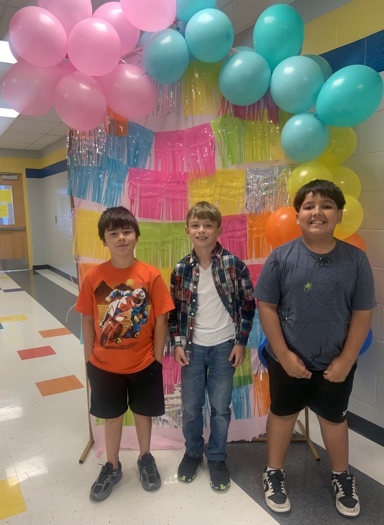 students with a colorful backdrop