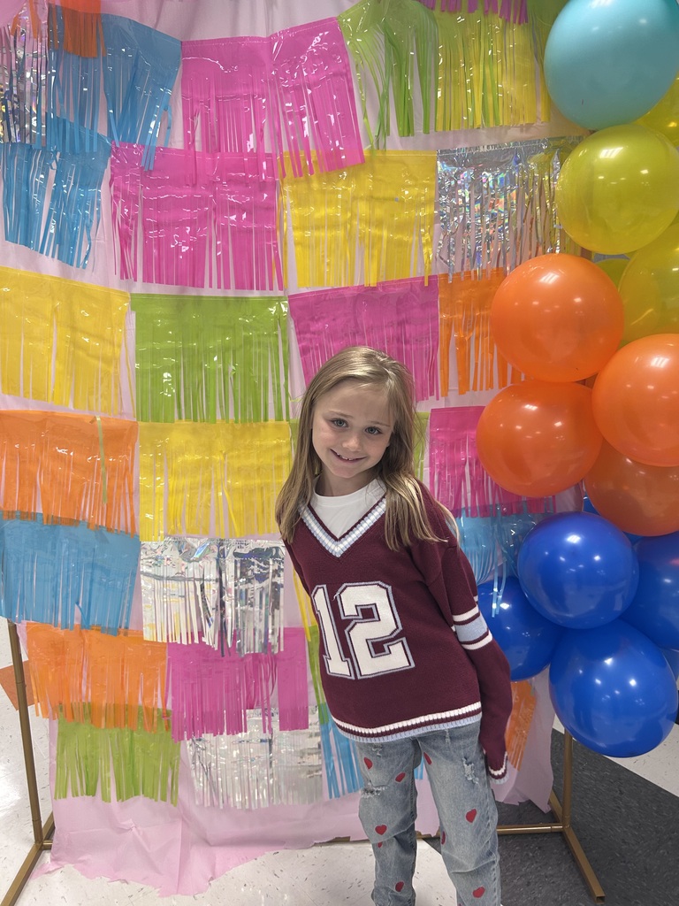 students with a colorful backdrop