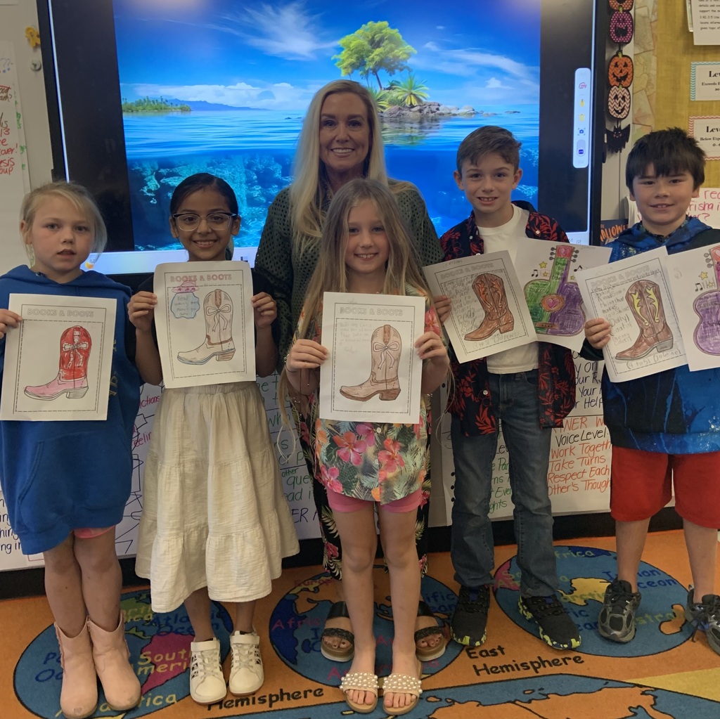 Beach day photo of students with colored pictures