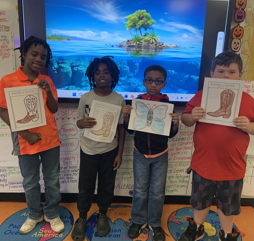 Beach day photo of students with colored pictures