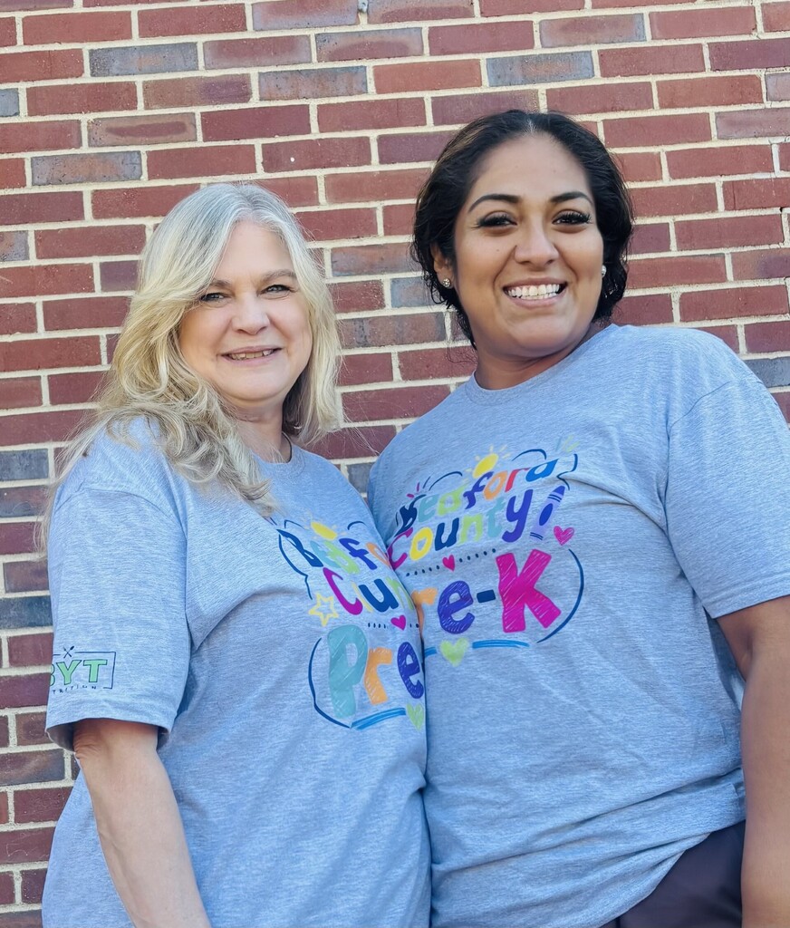 A group of Pre-K teachers are posed for a picture wearing matching t-shirts.